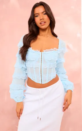 Top corset bleu tissé texturé à dentelle et volants